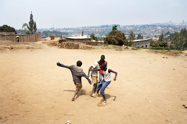 Kigali: Boys play football in Cyagugu suburb, Kigali,
