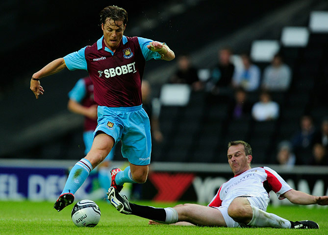 Kits: Scott Parker of West Ham United battles with Dietmar Hamann of MK Dons 