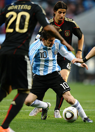 World Cup Quarter Finals: Argentina striker Lionel Messi tries to beat German defenders