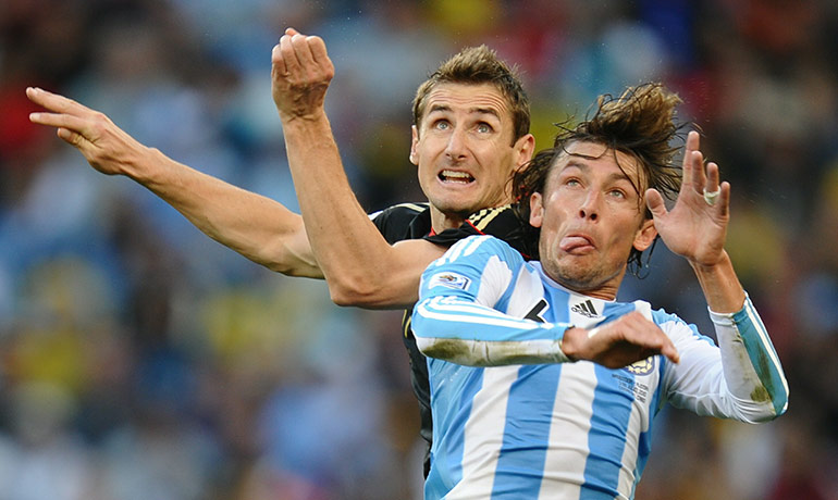 World Cup Quarter-Finals: Argentina's Gabriel Heinze and Germany's Miroslav Klose go up for a header