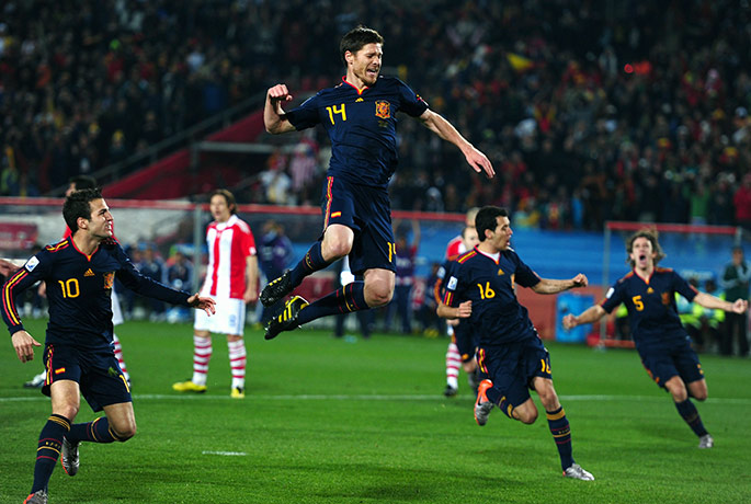 Paraguay versus spain: Xavi Alonso celebrates after a penalty but it has to be retaken