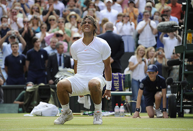 Men's singles final: Rafael Nadal performs a forward roll in celebration