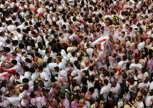 24 hours in pictures: Revellers wait for the the start of the San Fermin Festival 