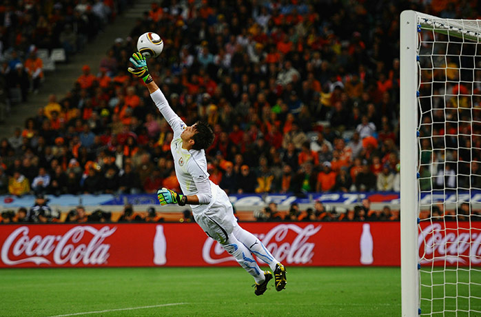 Holland versus Uruguay: Uruguay goalkeeper Fernando Muslera fails to save a shot by Van Bronckhorst