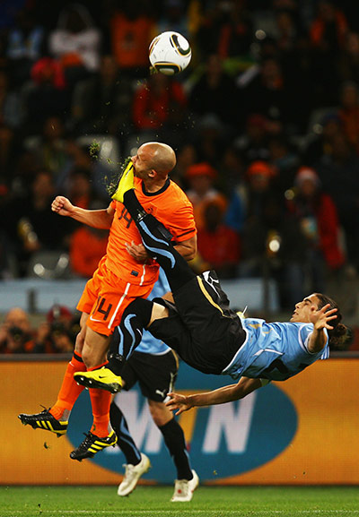 Holland versus Uruguay: Martin Caceres accidently kicks the mouth of Demy De Zeeuw 