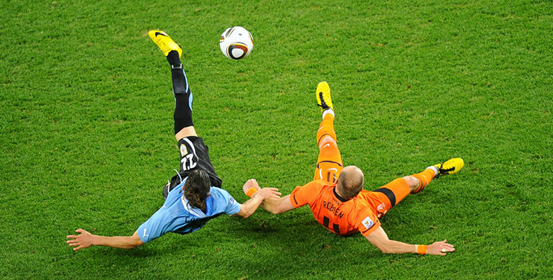 Holland versus Uruguay: Uruguay's defender Martin Caceres and Holland striker Arjen Robben