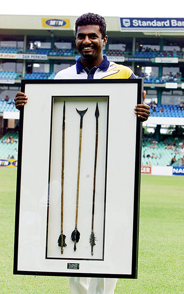 Muttiah Muralitharan: Muralitharan with trophy presented to him for getting 300 wickets