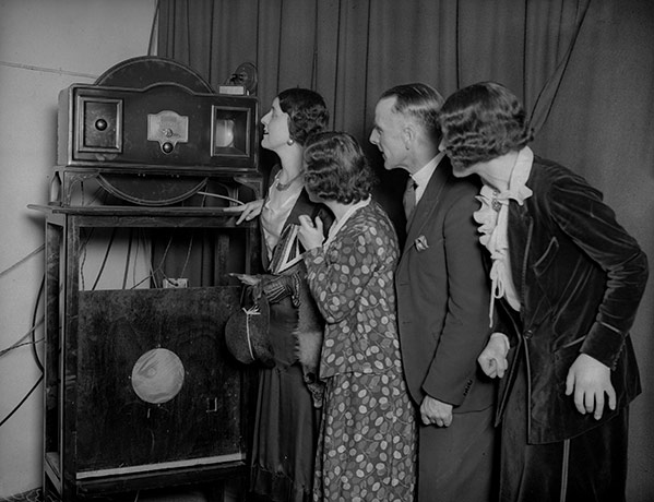 Television: 1931: A group fascinated by a Baird television