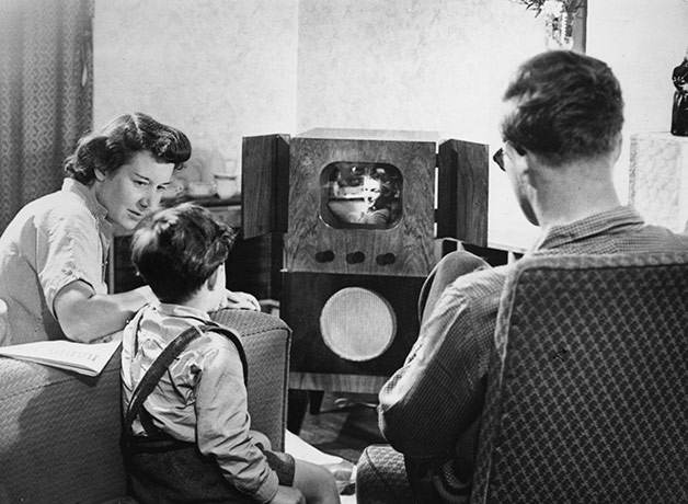Television: 1950: A family watching television at home