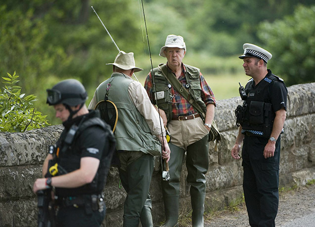 the hunt for raoul moat: Armed police officers look for Raoul Moat in Rothbury