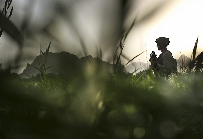 24 hours in pictures: Kandahar City, Afghanistan: A US soldier from Bravo Company