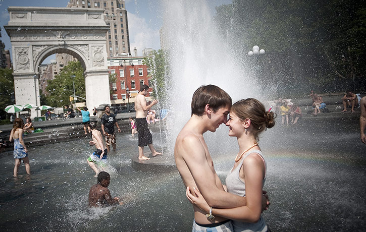 Heatwave: People stay cool in a fountain in Washington Square Park in New York