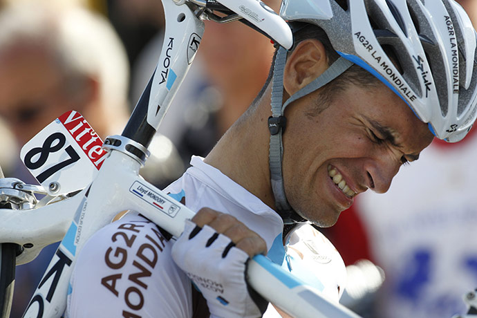 TDF Crashes: Lloyd Mondory grimaces as he walks to the finish line