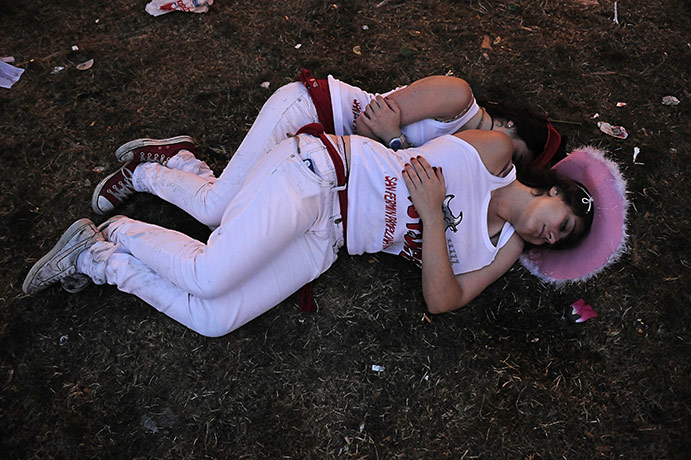 San Fermín fiesta: Revelers sleep in a park