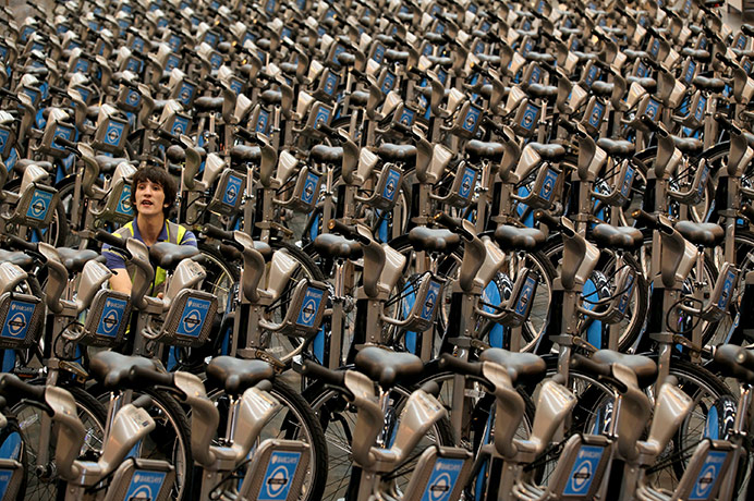 24 hours in pictures: London, UK: A workman puts the finishing touches to a fleet of bicycles