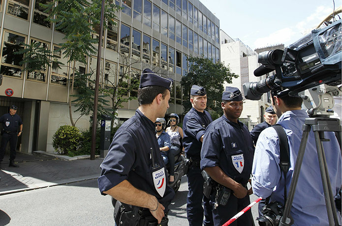 Bettencourt case 2: French policemen stand guard at front of the headquarters of Clymene