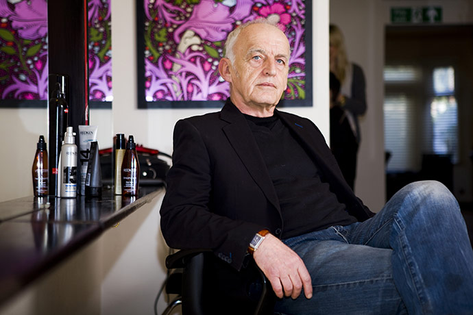 Fair Trade Town: A man man in jeans and smart jacket sits in a hairdressers salon