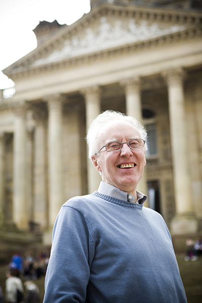 Fair Trade Town: An elderly man smiles in front of a municipal building