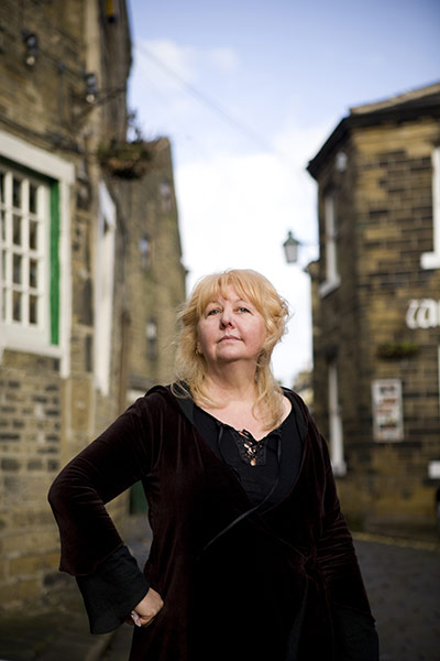 Fair Trade Town: A blonde middle aged woman stands in street