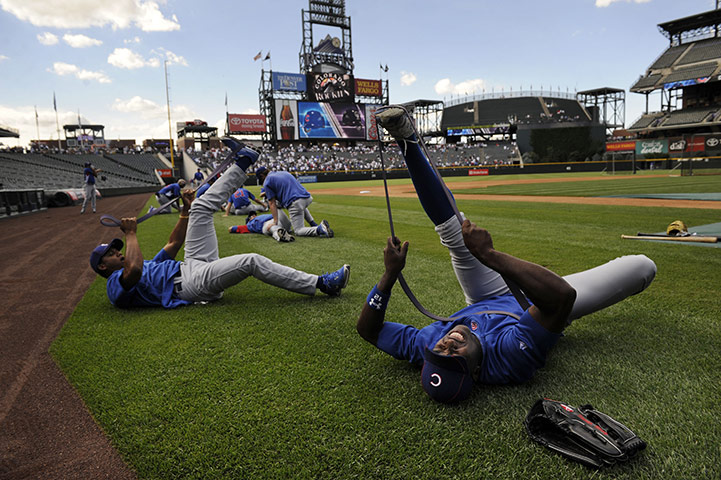 24 hours: Denver, Colorado, USA: Chicago Cubs strech prior to a baseball game