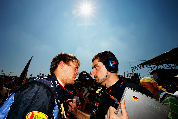 Hungarian grand prix: Sebastian Vettel of Germany talks with Guillaume Rocquelin