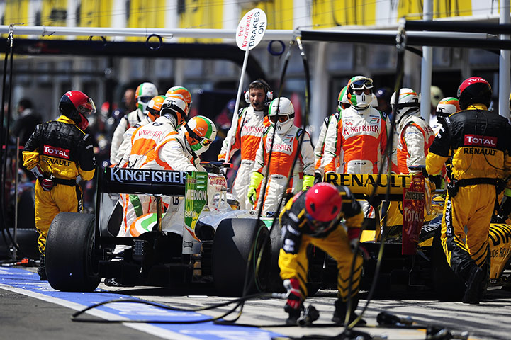 Hungarian grand prix: Adrian Sutil and Robert Kubica collide in the pits