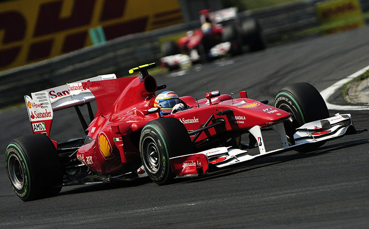 Hungarian grand prix: Ferrari's Spanish driver Fernando Alonso drives ahead of Felipe Massa 
