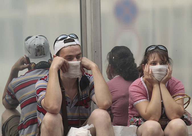 Moscow smog: People sit and wait for their flights at Vnukovo airport outside Moscow