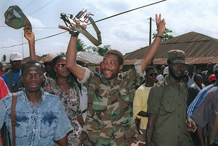 Charles Taylor Retro: Rebel leader Charles Taylor celebrates taking over power from Samuel Doe