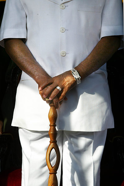 Charles Taylor Retro: Charles Taylor's trademark white suit, watch and walking stick