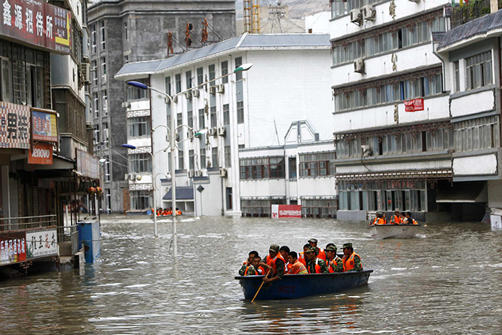 China floods update: Rescuers use boats in their rescue operation, China floods