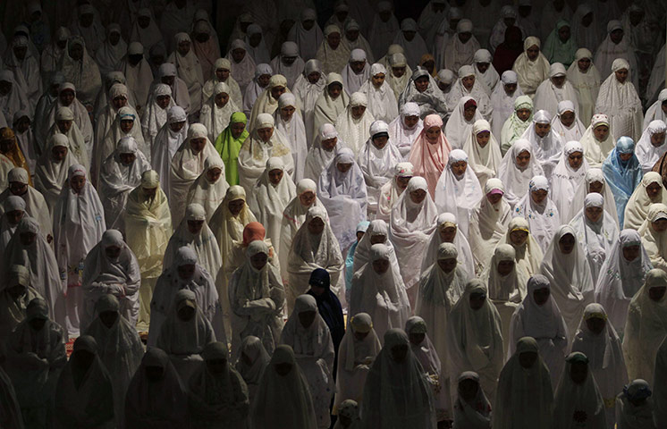 24 hours in pictures: Muslims attend evening prayers to mark the start of Ramadan 