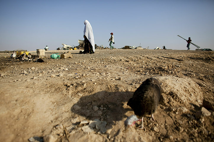 24 hours in pictures: Bedouin women rebuild a temporary house in the Negev desert