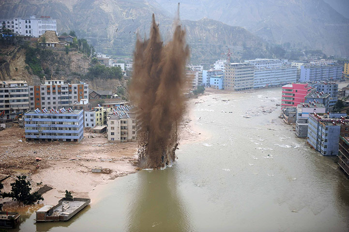 China Flood update: Chinese rescuers use explosives flood aftermath in China
