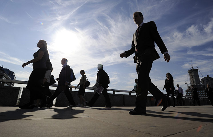 Week in Business: City workers cross London Bridge during the morning rush-hour