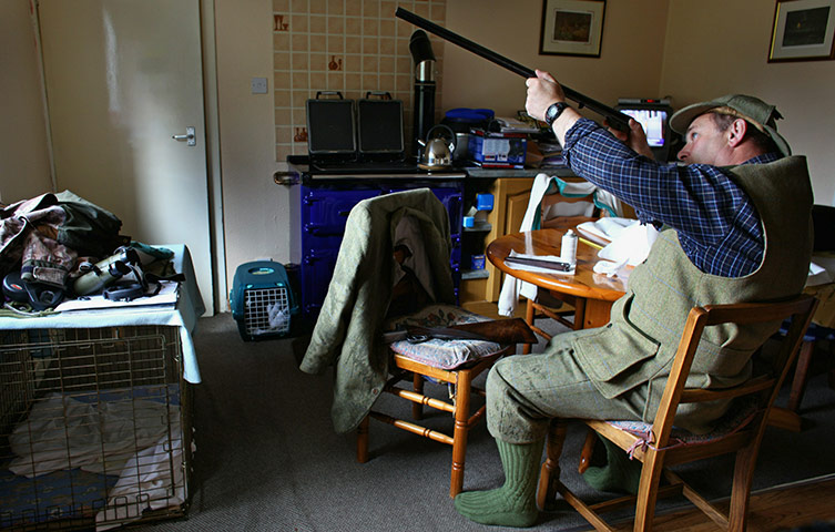 Grouse shooting : A Gamekeeper cleans his gun before the start of the grouse shooting season
