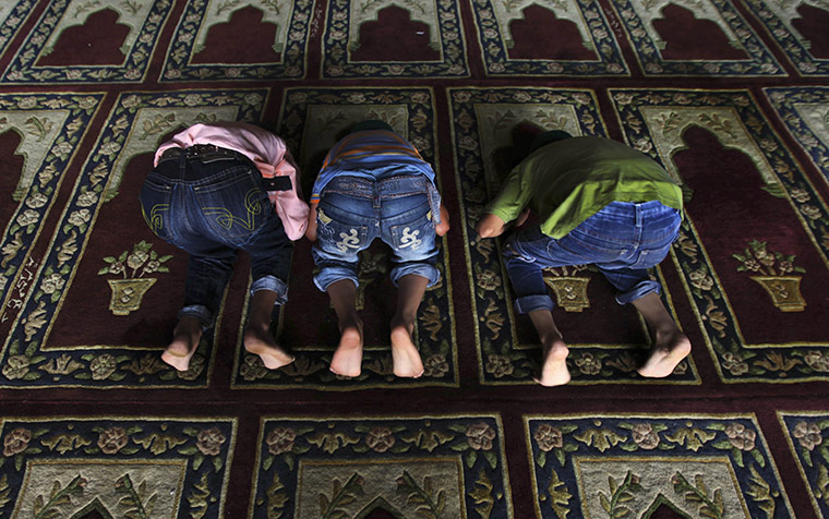 24 hours: Srinagar, India: Kashmiri Muslim boys offer prayers 