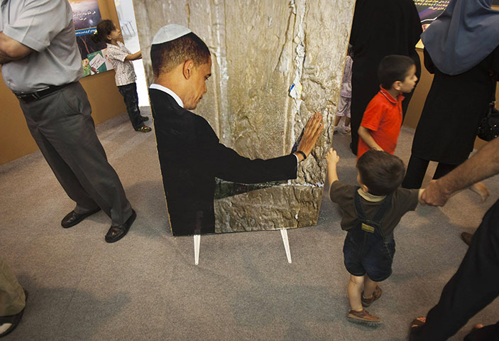 24 Hours in Pictures: A picture of Barack Obama at the International Koran exhibition in Tehran