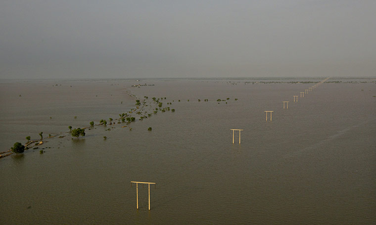 24 hours in pictures: Flooded land is seen from a  Pakistan Army helicopter on an aid mission 