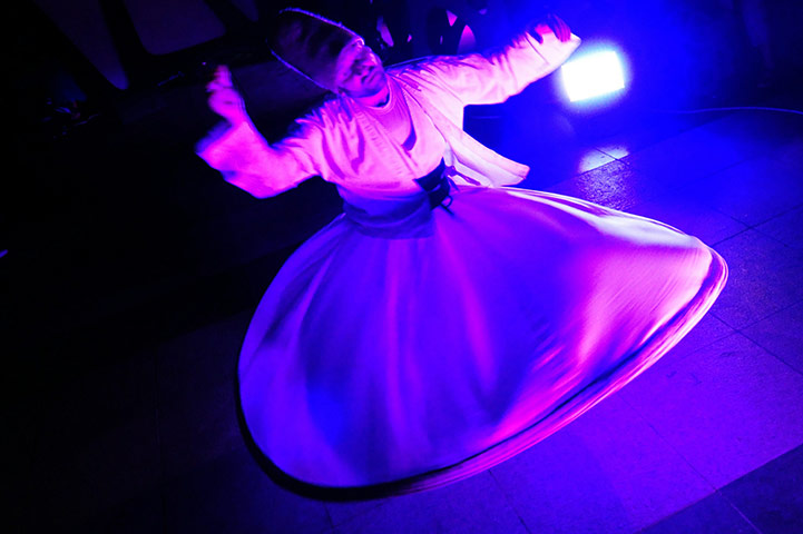 24 hours in pictures: Istanbul, Turnkey: A whirling dervish performs during a Ramadan festival 