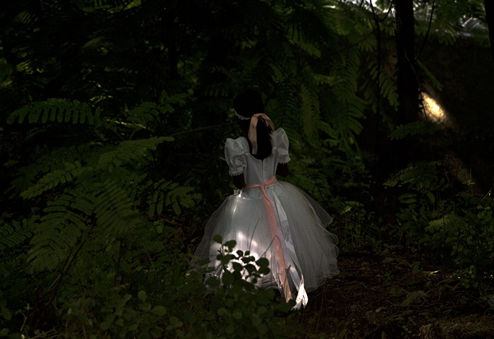 24 hours in pictures: Port-au-Prince, Haiti: A girl dressed for church walks home 