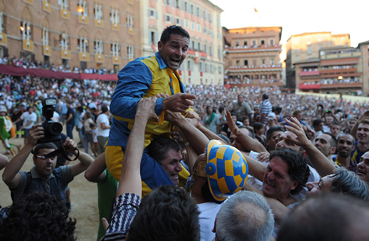 Palio race: Luigi Bruschelli of The Tartuca celebrates victory