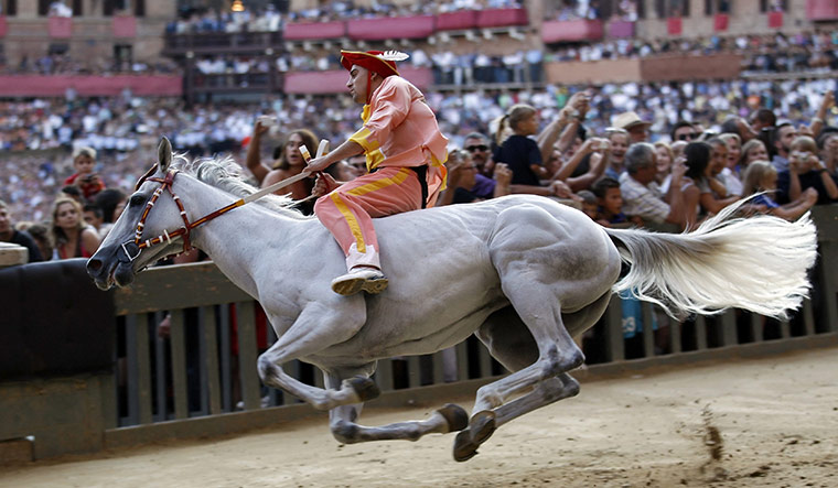 Palio race: A jockey from Montone parish rides his horse during a training session