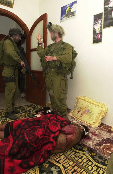 IDF facebook pictures: members of the Israeli Defence Force posing with captured Palestinians