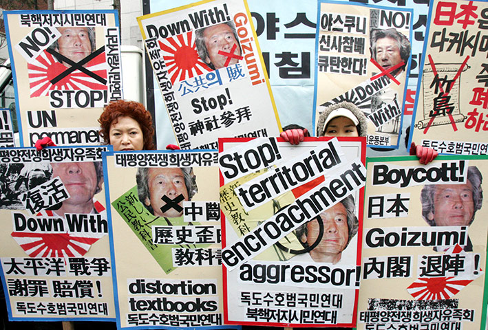 Korean Islands: Protesters hold placards during a rally against Japan's sovereignty claims