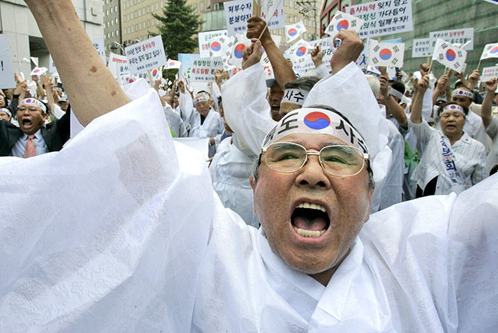 Korean Islands: Korea Liberation Association shout a slogan during a rally