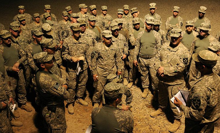 24 hours: Soldiers listening to a convoy brief at Contingency Operating Base, Iraq