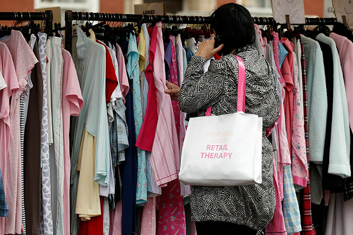 Week in Business: A shopper searches for clothing bargains at Bolton Market