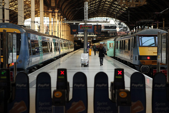 Week in Business: A woman boards a National Express train