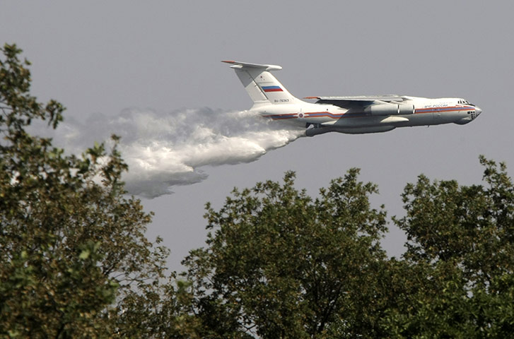 Forest fires in Russia: A Russia Iliushin-76 tanker plane releases water on a forest fire